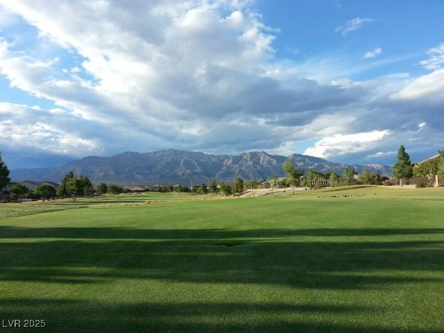 7332 Redhead Dr, North Las Vegas, NV 89084 - view of community with a mountain view, a yard, and view of golf course