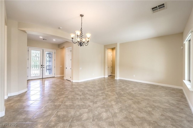 7332 Redhead Dr, North Las Vegas, NV 89084 - spare room featuring a chandelier, french doors, and light tile patterned floors