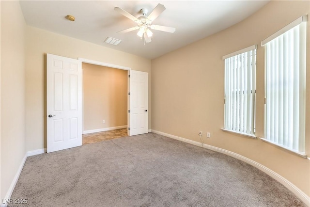 7332 Redhead Dr, North Las Vegas, NV 89084 - unfurnished bedroom featuring carpet floors and a ceiling fan