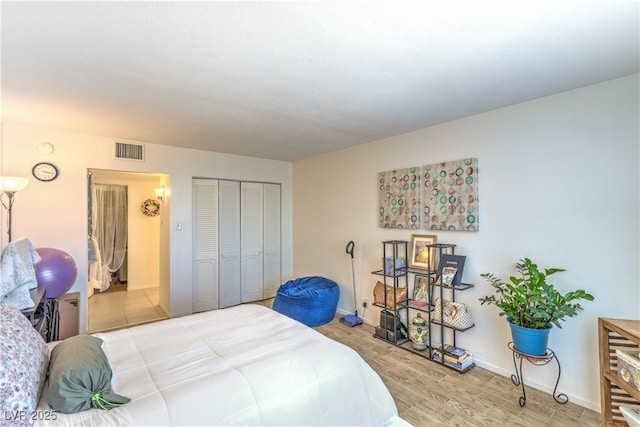3930 University Center Dr Unit 706, Las Vegas, NV 89119 - bedroom featuring light wood finished floors, a closet, and baseboards