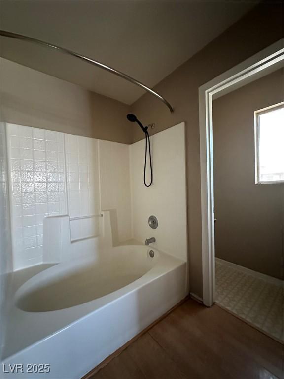 5128 Sandstone Dr, Las Vegas, NV 89142 - bathroom featuring shower / bathtub combination and wood finished floors