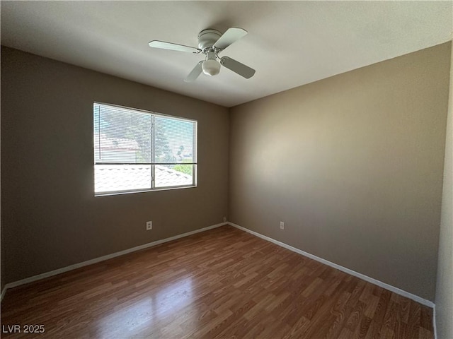 5128 Sandstone Dr, Las Vegas, NV 89142 - unfurnished room with wood finished floors, baseboards, and ceiling fan
