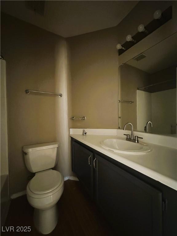 5128 Sandstone Dr, Las Vegas, NV 89142 - full bath with vanity, toilet, shower / tub combination, and baseboards