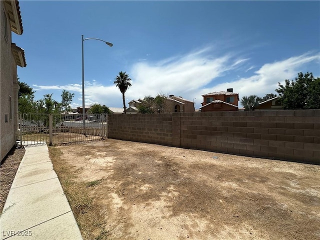 5128 Sandstone Dr, Las Vegas, NV 89142 - view of yard featuring a gate