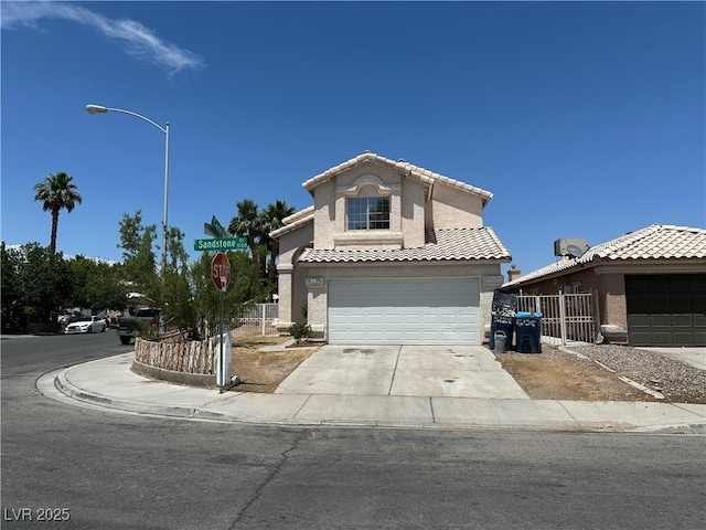 5128 Sandstone Dr, Las Vegas, NV 89142 - view of front of home featuring driveway, a garage, stucco siding, and a tile roof