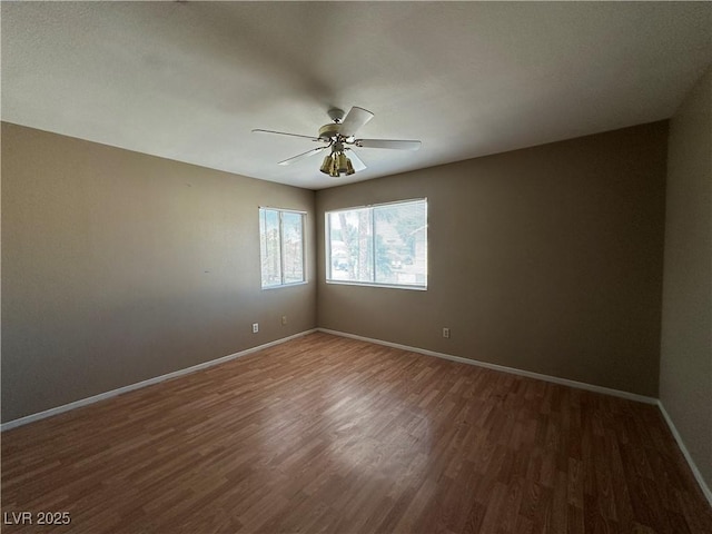 5128 Sandstone Dr, Las Vegas, NV 89142 - unfurnished room featuring wood finished floors, baseboards, and ceiling fan