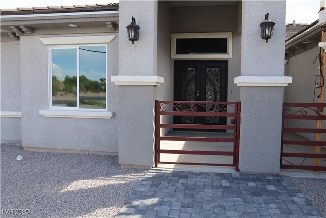 197 E Shelbourne Ave, Las Vegas, NV 89123 - view of exterior entry featuring stucco siding and a gate