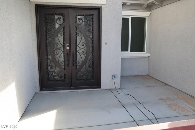 197 E Shelbourne Ave, Las Vegas, NV 89123 - view of exterior entry featuring french doors and stucco siding