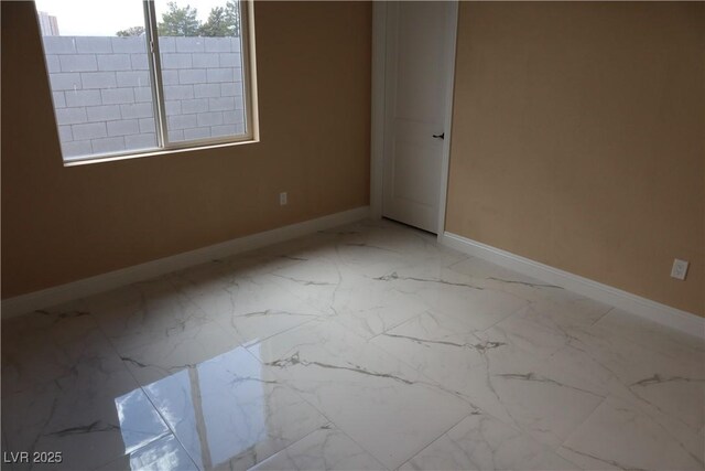 197 E Shelbourne Ave, Las Vegas, NV 89123 - spare room with baseboards and light marble finish flooring