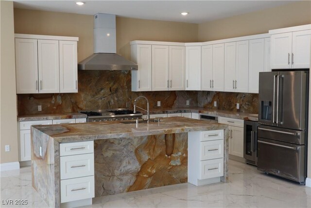 197 E Shelbourne Ave, Las Vegas, NV 89123 - kitchen with high quality fridge, wall chimney range hood, light marble finish flooring, wine cooler, and recessed lighting