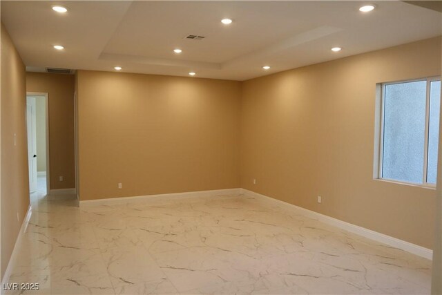197 E Shelbourne Ave, Las Vegas, NV 89123 - spare room featuring recessed lighting, light marble finish flooring, baseboards, and a raised ceiling