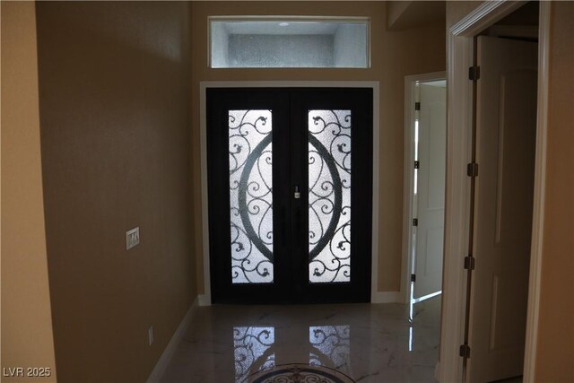 197 E Shelbourne Ave, Las Vegas, NV 89123 - entryway featuring french doors, baseboards, and marble tiled floors