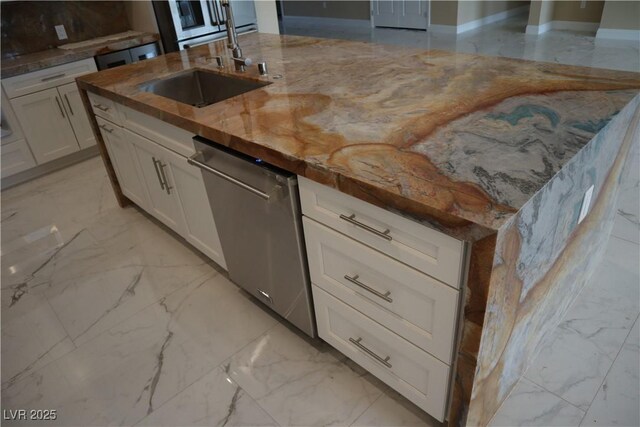 197 E Shelbourne Ave, Las Vegas, NV 89123 - kitchen featuring stainless steel dishwasher, light marble finish floors, white cabinets, a sink, and light stone counters