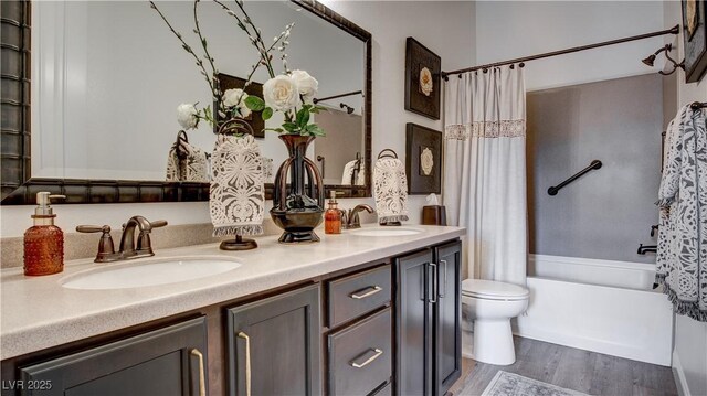 1869 Bronze Patina St, Henderson, NV 89044 - full bath with wood finished floors, double vanity, toilet, and shower / bath combo