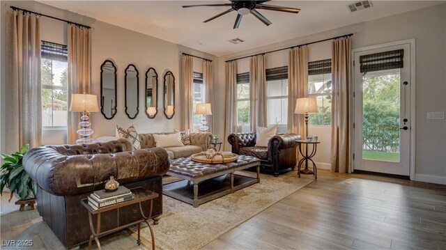 1869 Bronze Patina St, Henderson, NV 89044 - living area featuring ceiling fan, plenty of natural light, and wood finished floors