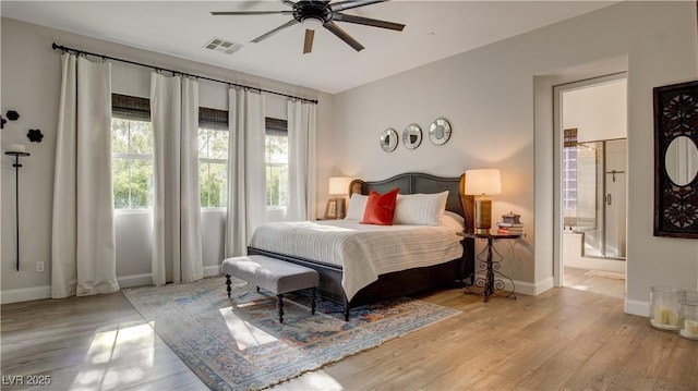 1869 Bronze Patina St, Henderson, NV 89044 - bedroom with wood finished floors, baseboards, connected bathroom, and ceiling fan