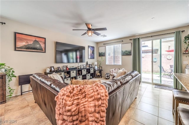 4212 Juanita May Ave, North Las Vegas, NV 89032 - living room featuring ceiling fan, light tile patterned floors, and baseboards
