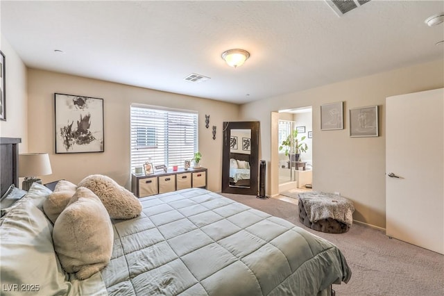 4212 Juanita May Ave, North Las Vegas, NV 89032 - carpeted bedroom featuring multiple windows and connected bathroom