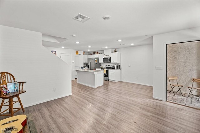 9929 Bumblebee Hills St, Las Vegas, NV 89141 - living room featuring recessed lighting, light wood-style flooring, and baseboards