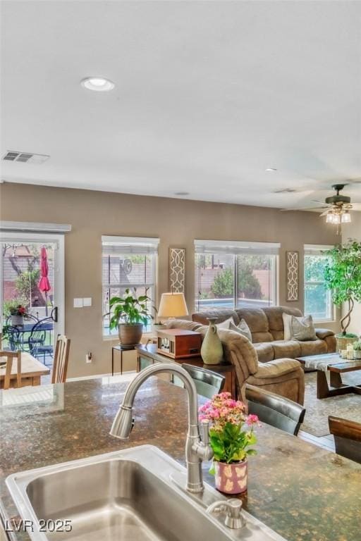 10420 Loma Portal Ave, Las Vegas, NV 89166 - living room with a ceiling fan and recessed lighting