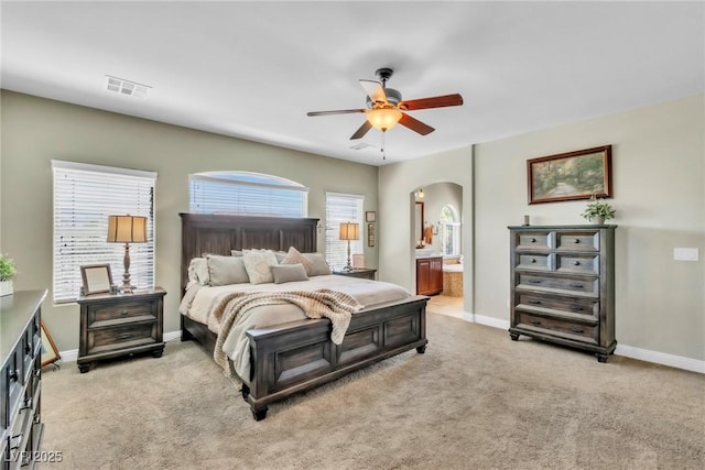 10420 Loma Portal Ave, Las Vegas, NV 89166 - bedroom with arched walkways, light colored carpet, and baseboards