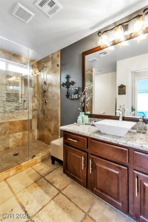 10420 Loma Portal Ave, Las Vegas, NV 89166 - full bath featuring vanity, a shower stall, and stone finish flooring