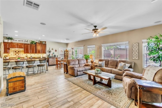 10420 Loma Portal Ave, Las Vegas, NV 89166 - living room with a ceiling fan, light wood-style flooring, and recessed lighting