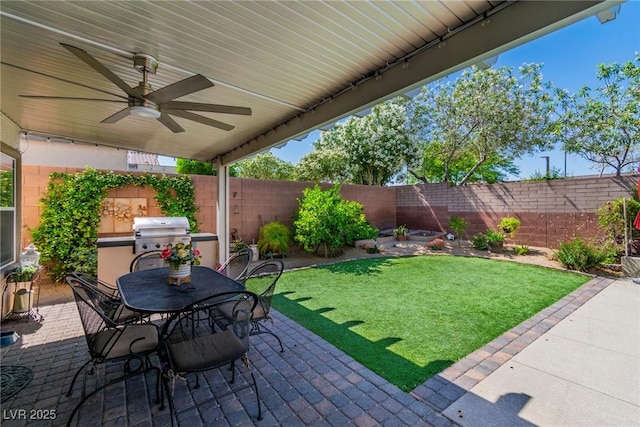 10420 Loma Portal Ave, Las Vegas, NV 89166 - view of patio featuring grilling area, ceiling fan, and outdoor dining area