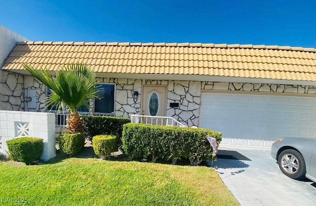 3766 Colonial Dr, Las Vegas, NV 89121 - view of front facade featuring a tile roof, a garage, driveway, and a front yard