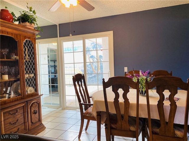 3766 Colonial Dr, Las Vegas, NV 89121 - dining room featuring a textured ceiling, light tile patterned floors, and ceiling fan