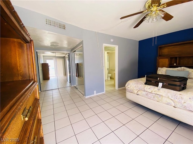 3766 Colonial Dr, Las Vegas, NV 89121 - living area featuring light tile patterned flooring, ceiling fan, and baseboards
