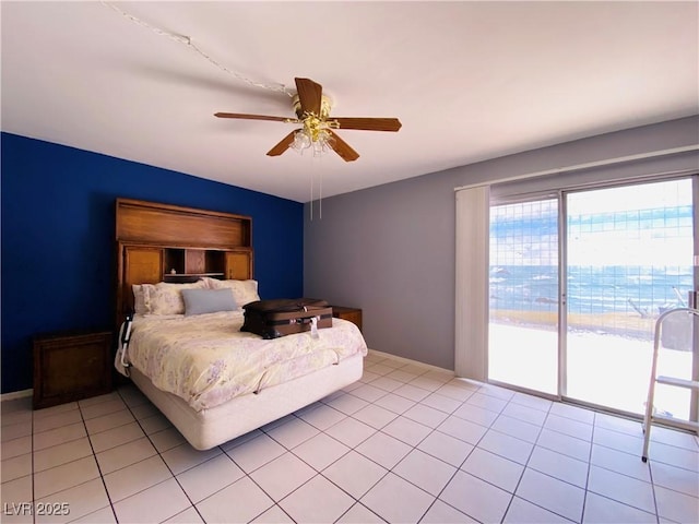 3766 Colonial Dr, Las Vegas, NV 89121 - bedroom featuring access to exterior, light tile patterned flooring, and a ceiling fan