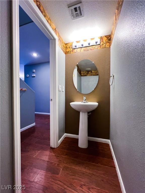 3412 Catherine Mermet Ave, North Las Vegas, NV 89081 - bathroom featuring hardwood / wood-style flooring and baseboards
