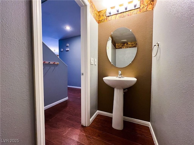 3412 Catherine Mermet Ave, North Las Vegas, NV 89081 - bathroom with wood finished floors, baseboards, and a sink