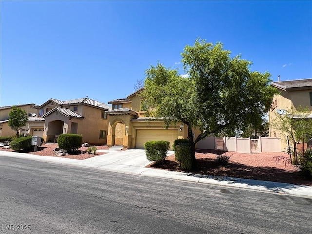 3412 Catherine Mermet Ave, North Las Vegas, NV 89081 - mediterranean / spanish home featuring stucco siding, concrete driveway, a tiled roof, and a garage