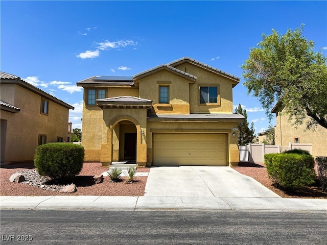 3412 Catherine Mermet Ave, North Las Vegas, NV 89081 - view of front of house featuring stucco siding, solar panels, driveway, and an attached garage