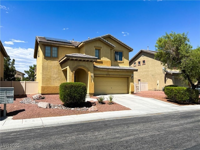 3412 Catherine Mermet Ave, North Las Vegas, NV 89081 - view of front of house featuring stucco siding, an attached garage, roof mounted solar panels, concrete driveway, and a tile roof