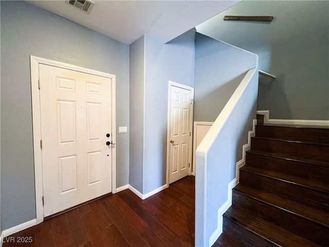 3412 Catherine Mermet Ave, North Las Vegas, NV 89081 - entrance foyer featuring dark wood-type flooring, stairway, and baseboards