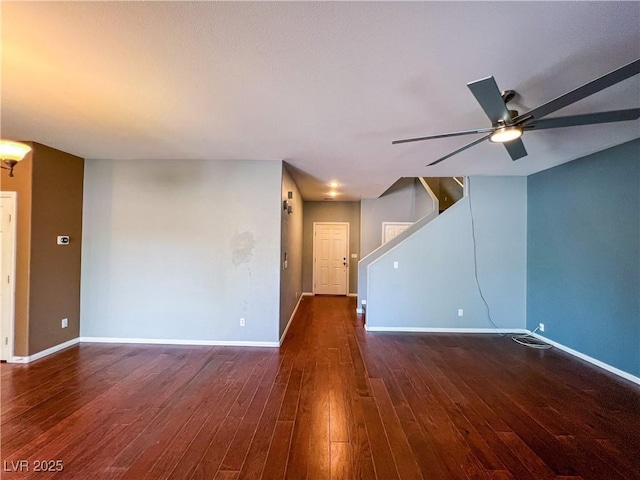 3412 Catherine Mermet Ave, North Las Vegas, NV 89081 - unfurnished living room with baseboards, wood-type flooring, ceiling fan, and stairway