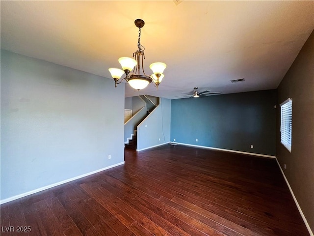 3412 Catherine Mermet Ave, North Las Vegas, NV 89081 - unfurnished room with dark wood-style floors, stairs, a ceiling fan, baseboards, and a chandelier