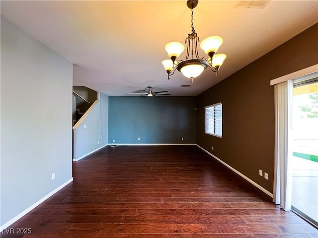 3412 Catherine Mermet Ave, North Las Vegas, NV 89081 - spare room featuring a chandelier, ceiling fan, wood finished floors, and healthy amount of natural light