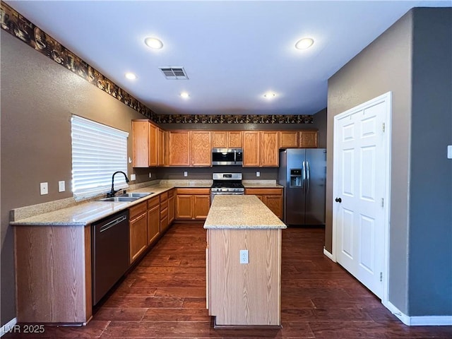 3412 Catherine Mermet Ave, North Las Vegas, NV 89081 - kitchen with stainless steel appliances, a sink, a kitchen island, dark wood-style flooring, and recessed lighting