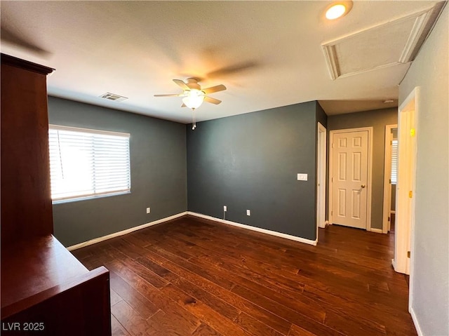 3412 Catherine Mermet Ave, North Las Vegas, NV 89081 - unfurnished room with baseboards, dark wood finished floors, a ceiling fan, and attic access