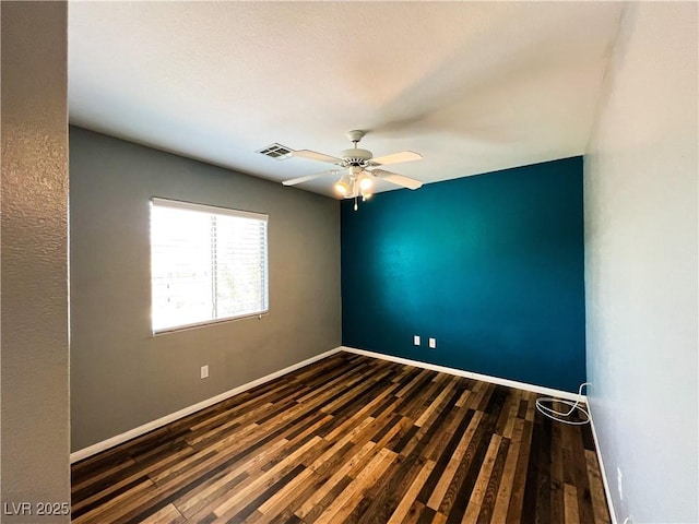 3412 Catherine Mermet Ave, North Las Vegas, NV 89081 - empty room with dark wood-type flooring, ceiling fan, and baseboards