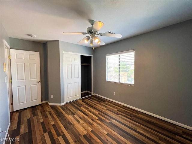 3412 Catherine Mermet Ave, North Las Vegas, NV 89081 - unfurnished bedroom featuring dark wood finished floors, a closet, baseboards, and ceiling fan