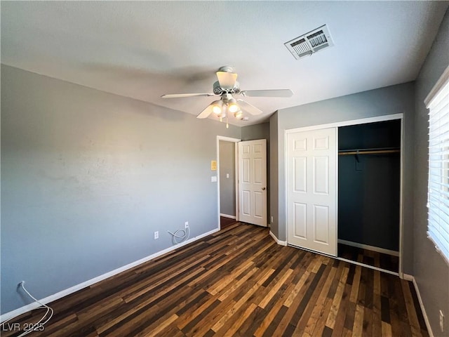 3412 Catherine Mermet Ave, North Las Vegas, NV 89081 - unfurnished bedroom with dark wood-style floors, baseboards, a closet, and a ceiling fan