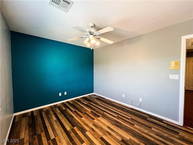 3412 Catherine Mermet Ave, North Las Vegas, NV 89081 - spare room featuring dark wood-style flooring, baseboards, and a ceiling fan