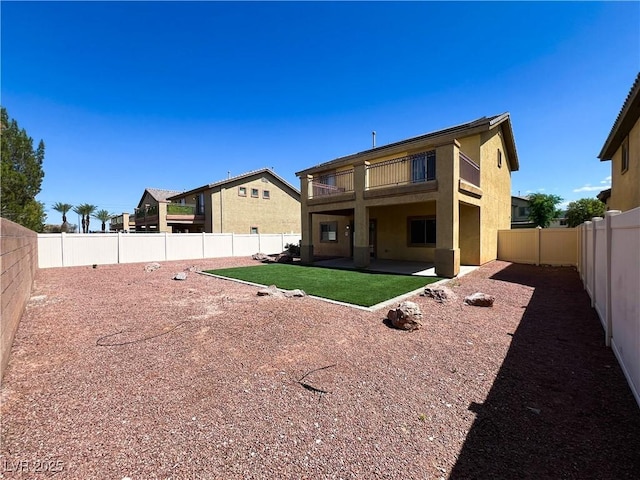 3412 Catherine Mermet Ave, North Las Vegas, NV 89081 - back of house featuring a balcony, stucco siding, and a patio