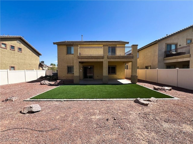 3412 Catherine Mermet Ave, North Las Vegas, NV 89081 - back of property with a patio, stucco siding, and a balcony