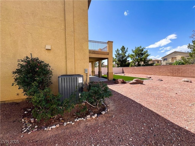 3412 Catherine Mermet Ave, North Las Vegas, NV 89081 - view of yard featuring central AC, a balcony, and a patio